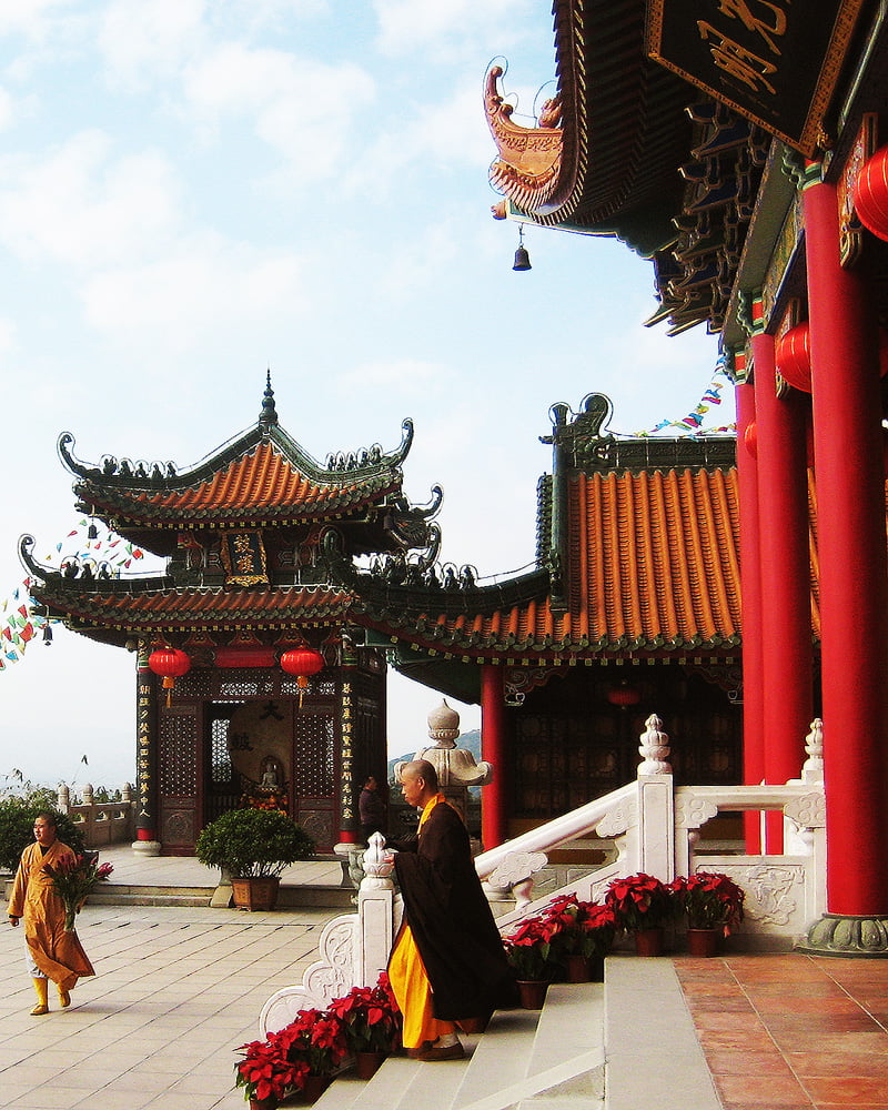 Ču-chaj - Jintai Temple in Doumen District of Zhuhai, Guangdong, China. An inner court view with clergy. Ču-chaj - Jintai Temple in Doumen District of Zhuhai, Guangdong, China. An inner court view with clergy.